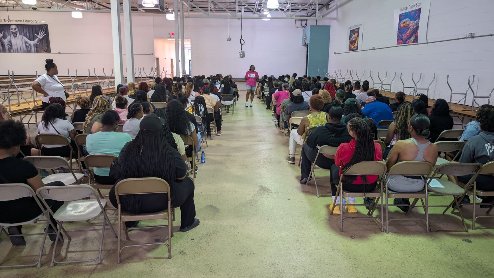The classroom packed with women waiting for the safety briefing to begin