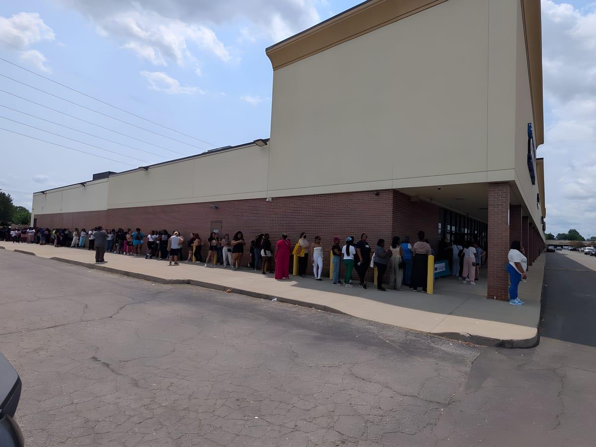 Students lined up along the outside of the building waiting to check in at Ladies Day 2026